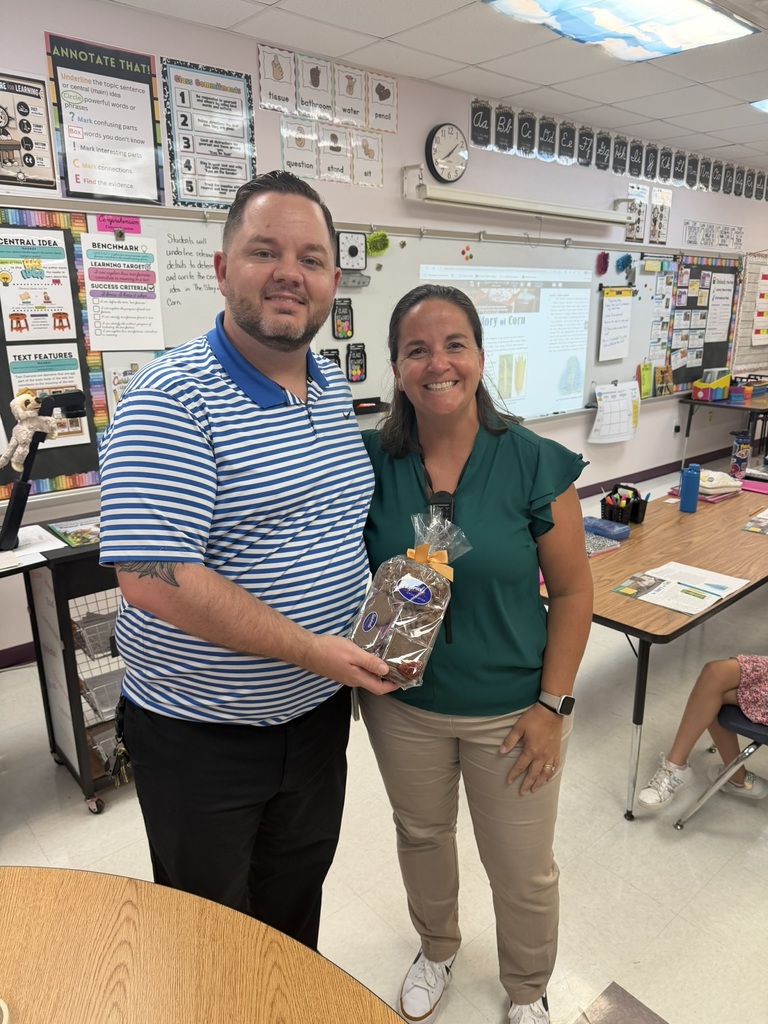 Principal Martin posing with Maureen Devine, Teacher of the Year Nominee