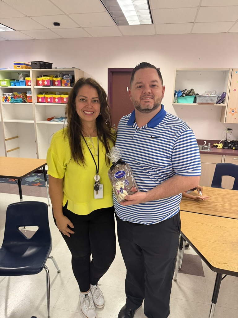 Principal Martin posing with Martha Correa, School-Related Employee of the Year Nominee