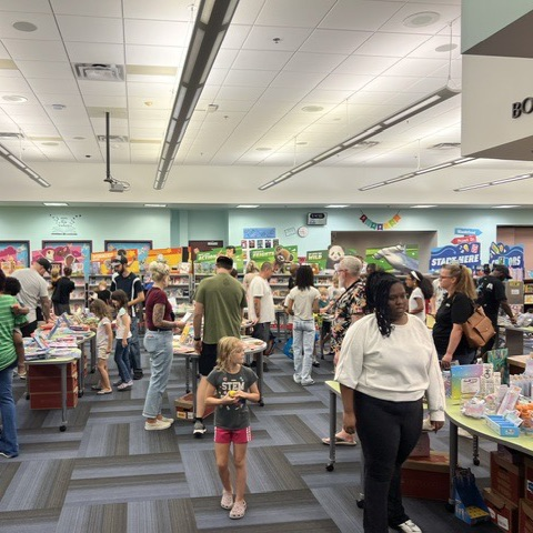 parents and students shopping at the book fair