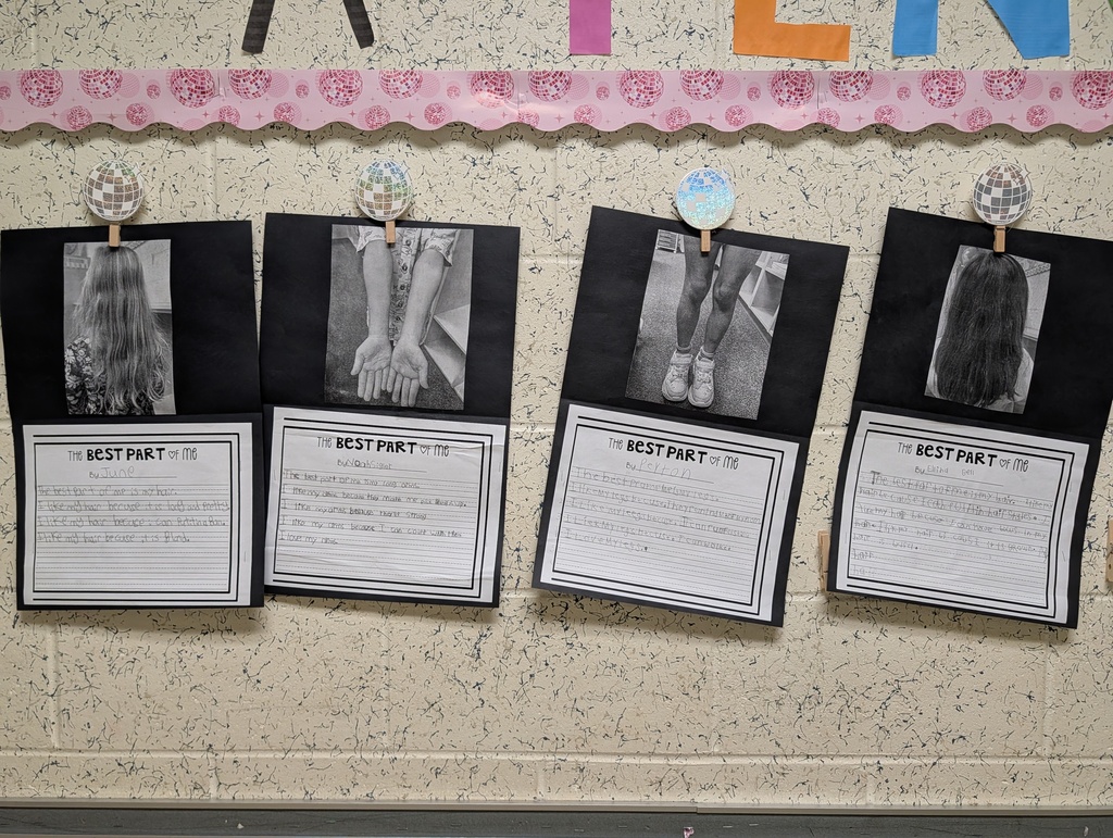 Four black-and-white photographs, each with text, are displayed on a wall with a pink border.
