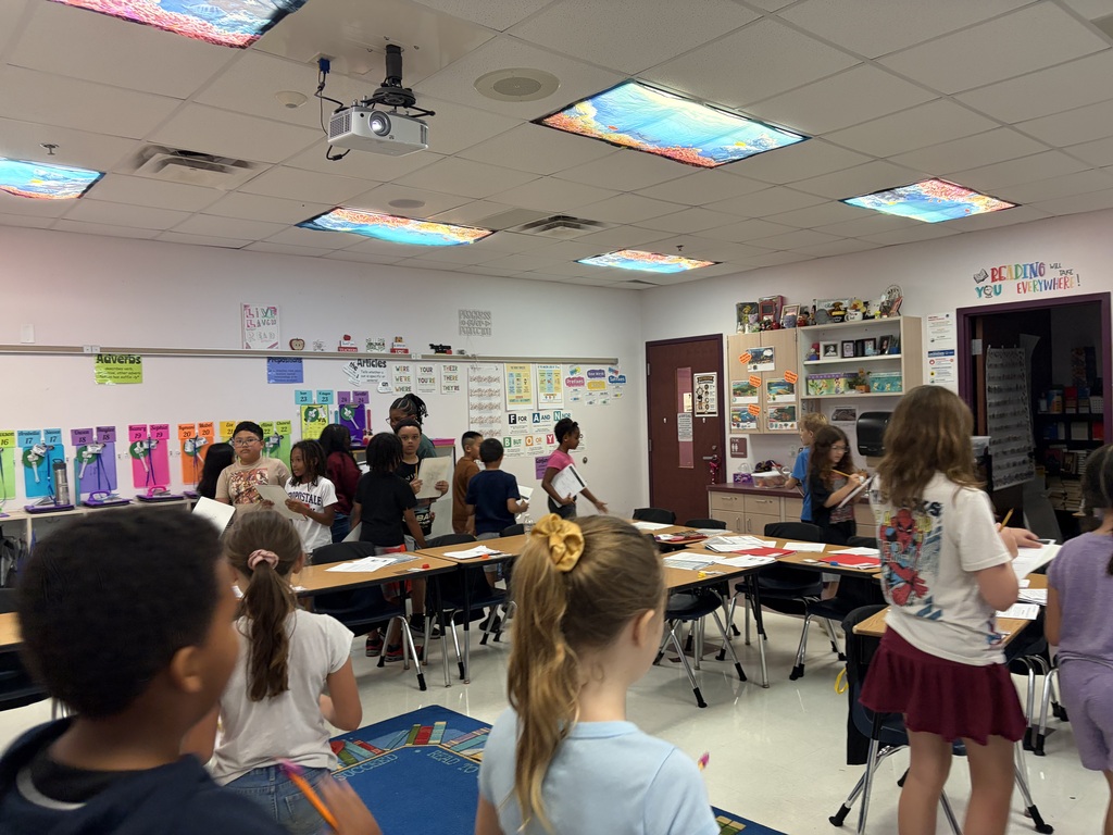students walking around the classroom