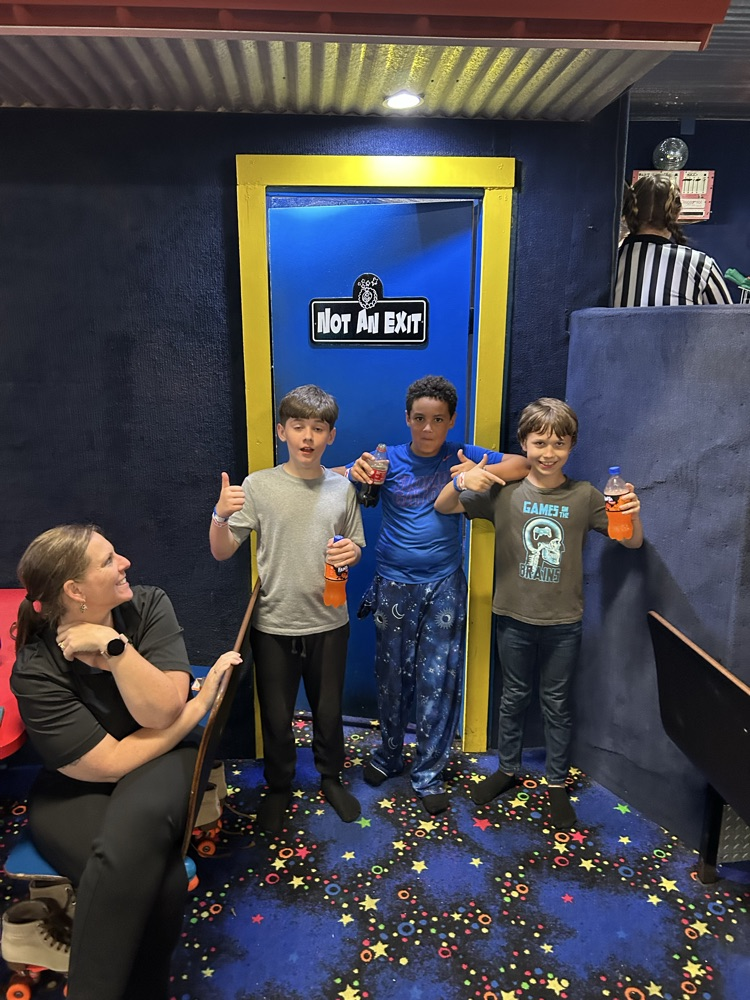 Students, Families and staff at skate station