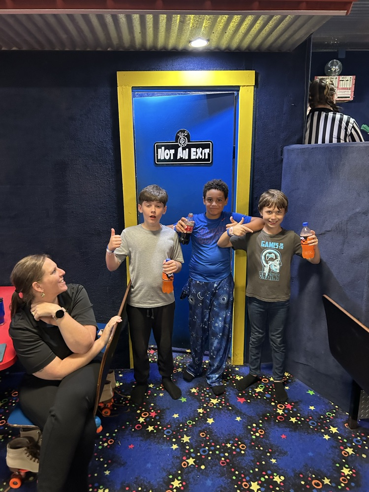 Students, Families and staff at skate station