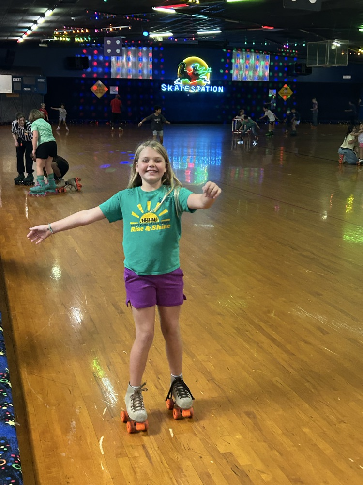 Students, Families and staff at skate station