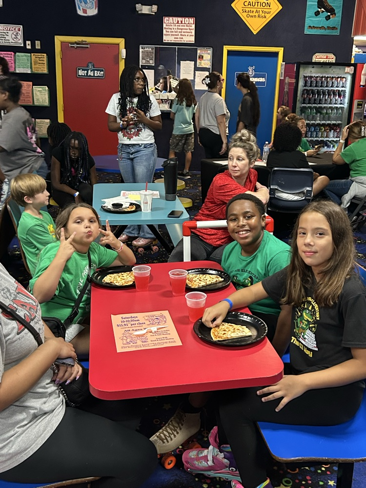 Students, Families and staff at skate station