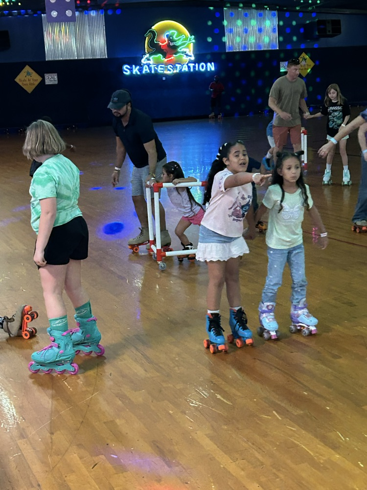 Students, Families and staff at skate station