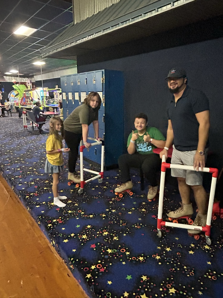Students, Families and staff at skate station
