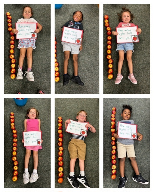 Multiple images of children lying on a floor. Each child holds a sign. Orange objects line the floor.