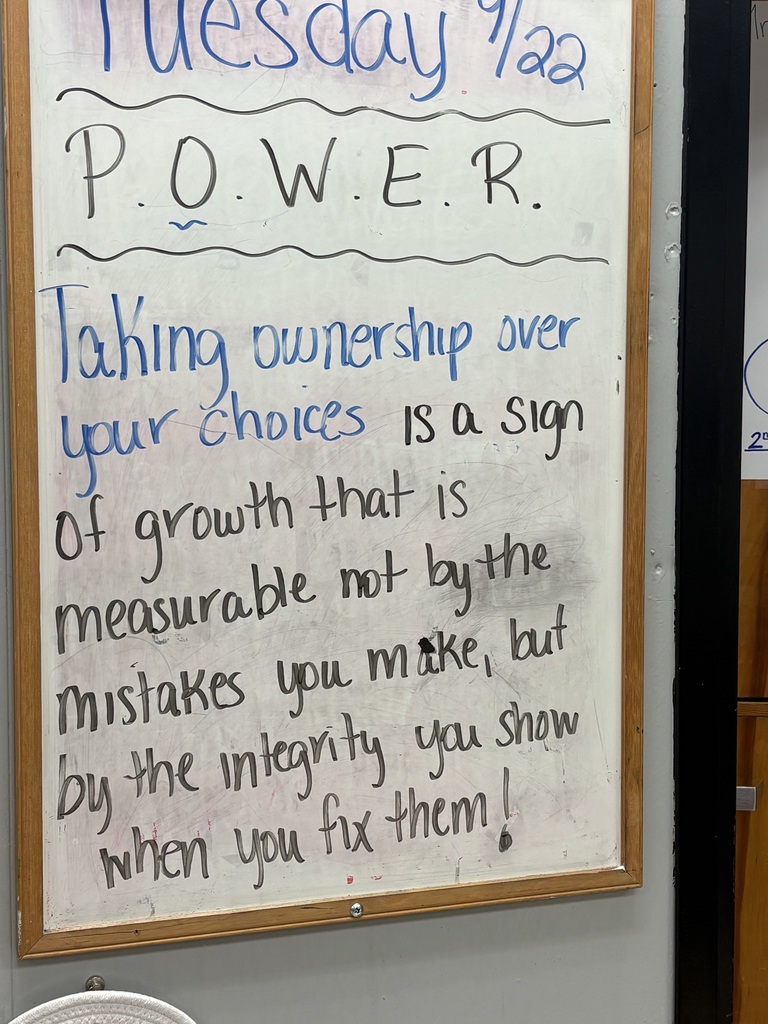 Whiteboard with blue and black writing. The message reads: "Taking ownership over your choices is a sign of growth."