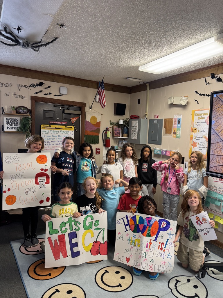 WEC signs for the basketball game