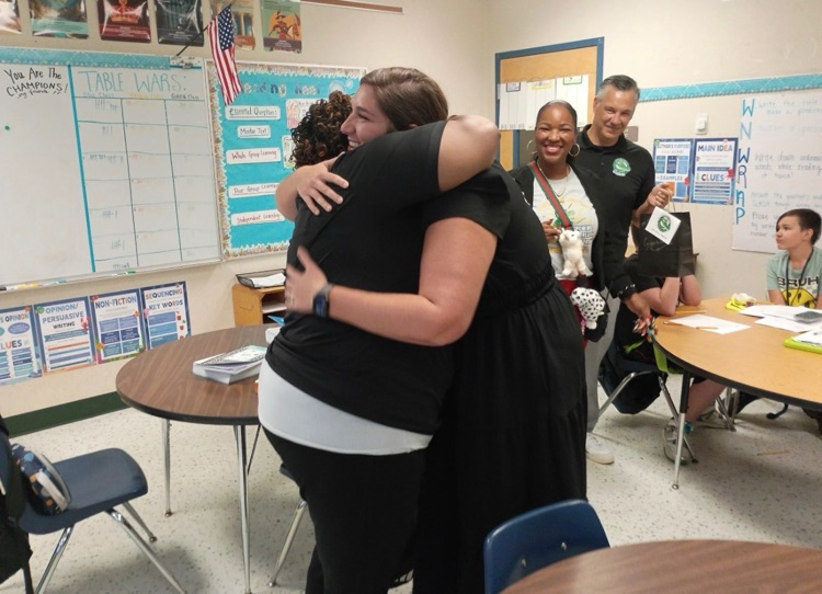 Pictures of Teachers and Students together posing and smiling for Teacher of the Year winner