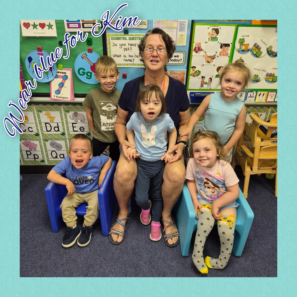 Adult and five children in chairs in classroom. Background has alphabet letters and pictures. Words "Mom Love for Kem" on left.