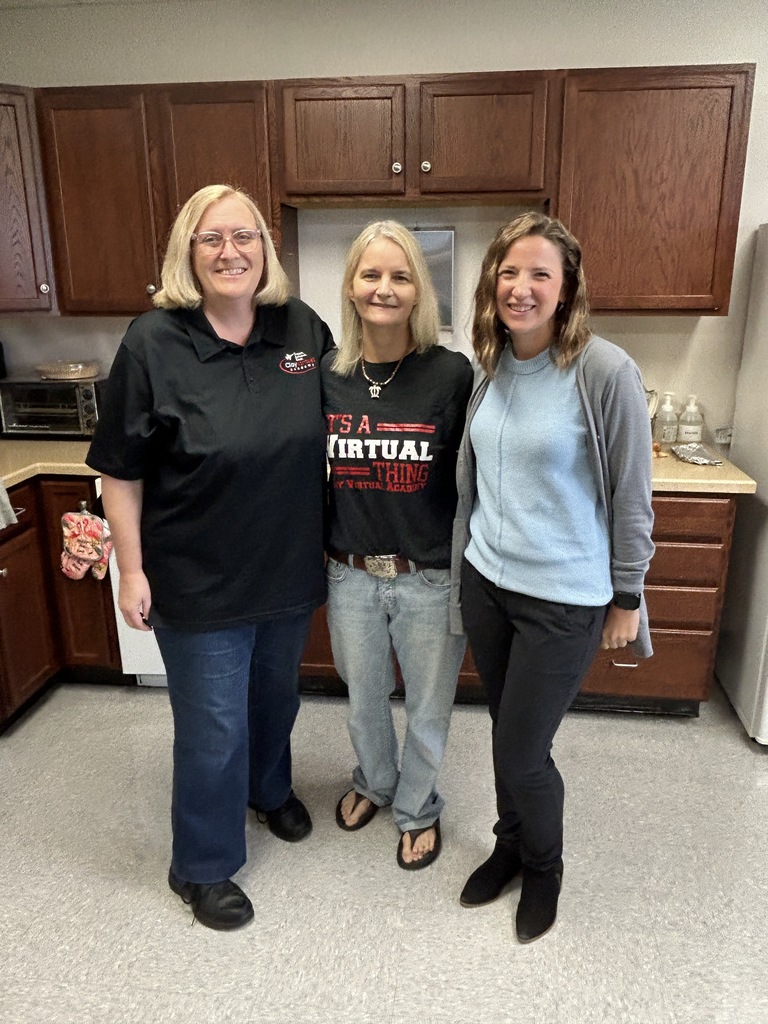 CVA Teacher of the Year Dawn Smith stands smiling with the two finalists for Teacher of the Year, Ashlei and Carol. 