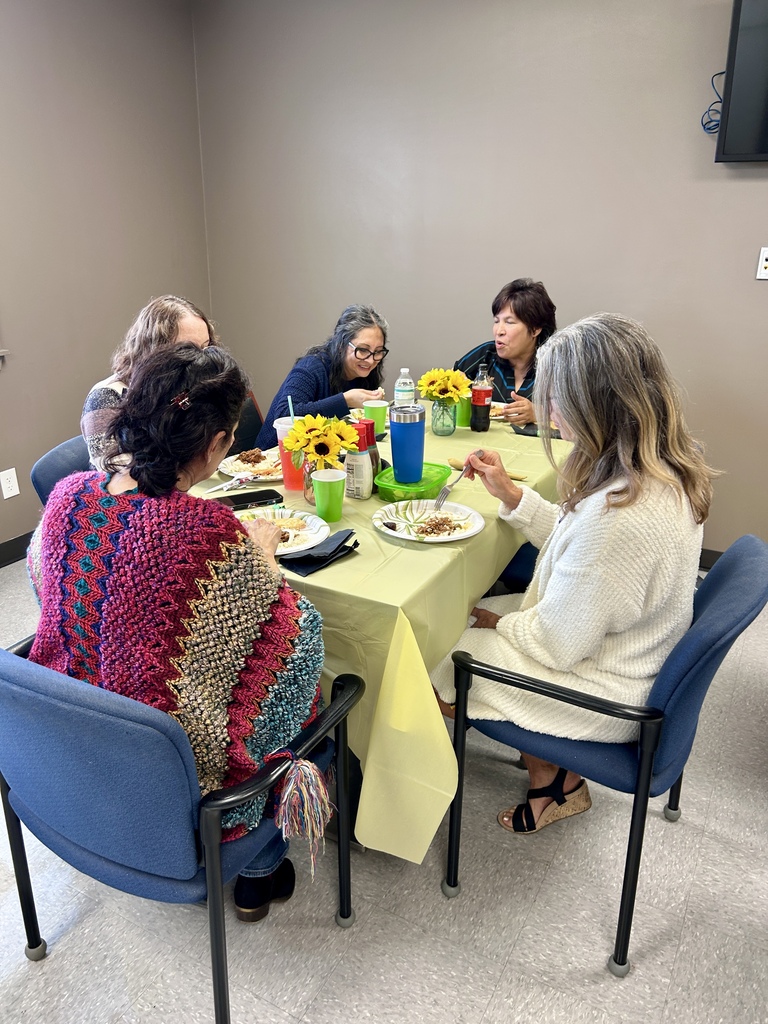 CVA staff members gather around a decorated table, enjoying lunch and conversation during Friday’s recognition celebration.