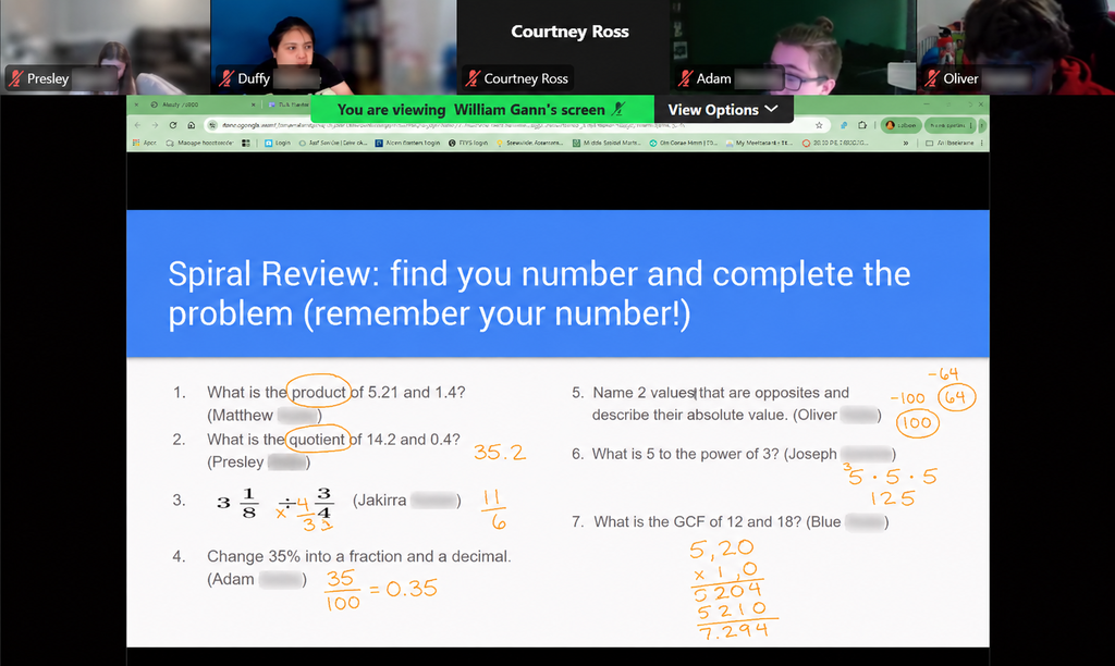 A computer screen displays a math problem. A blue banner reads, "Spiral Review; find your number and complete the problem (remember your number)".