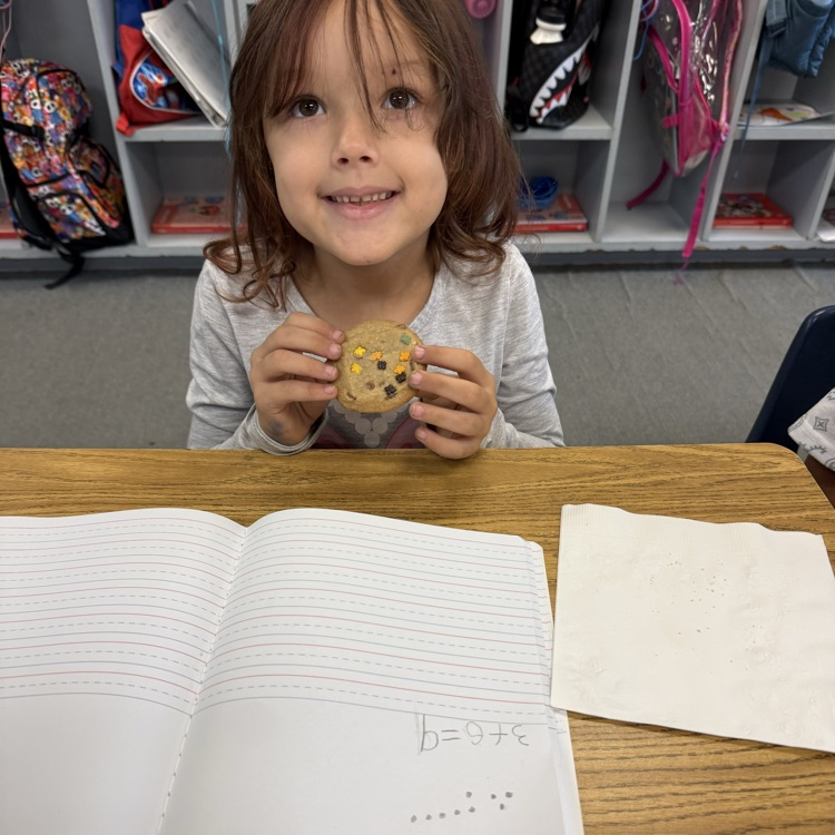 student with cookie for math visual