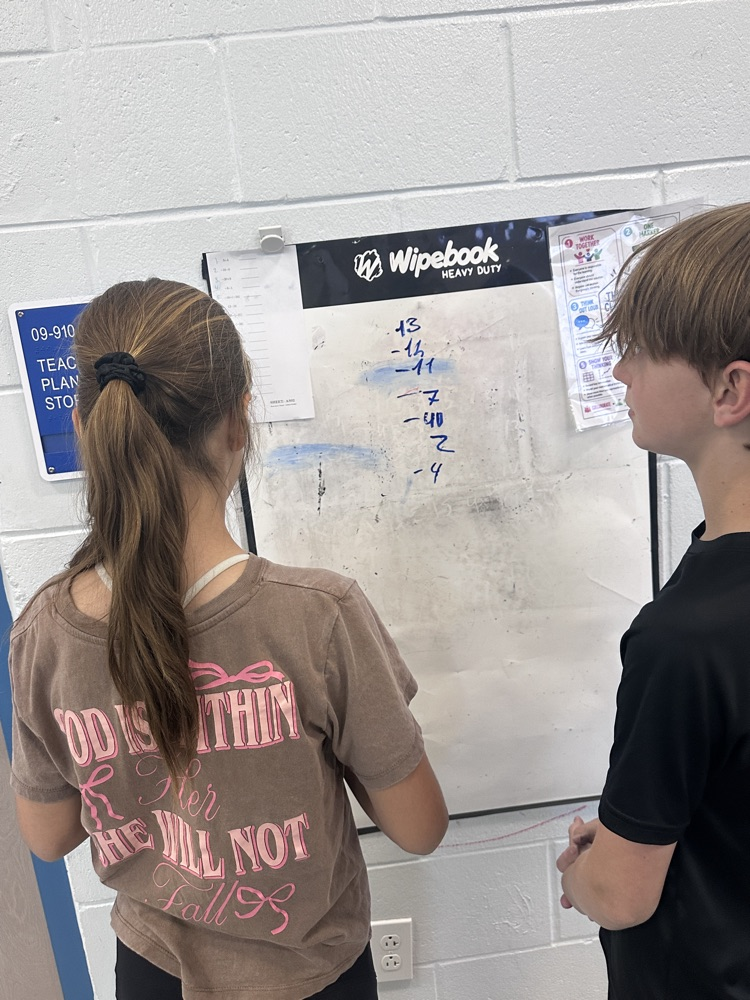 students working on math problems. 