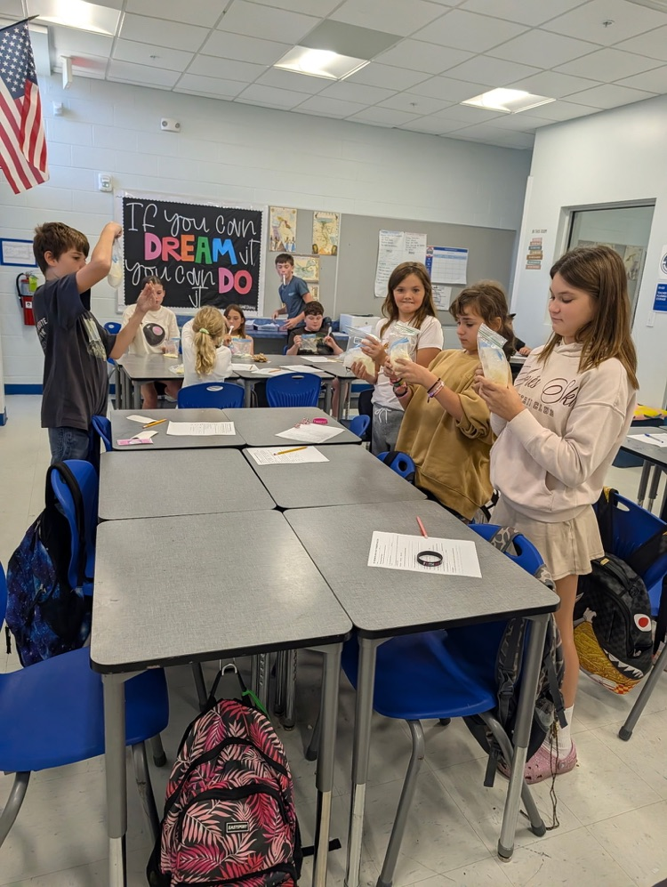 students making ice cream in science 