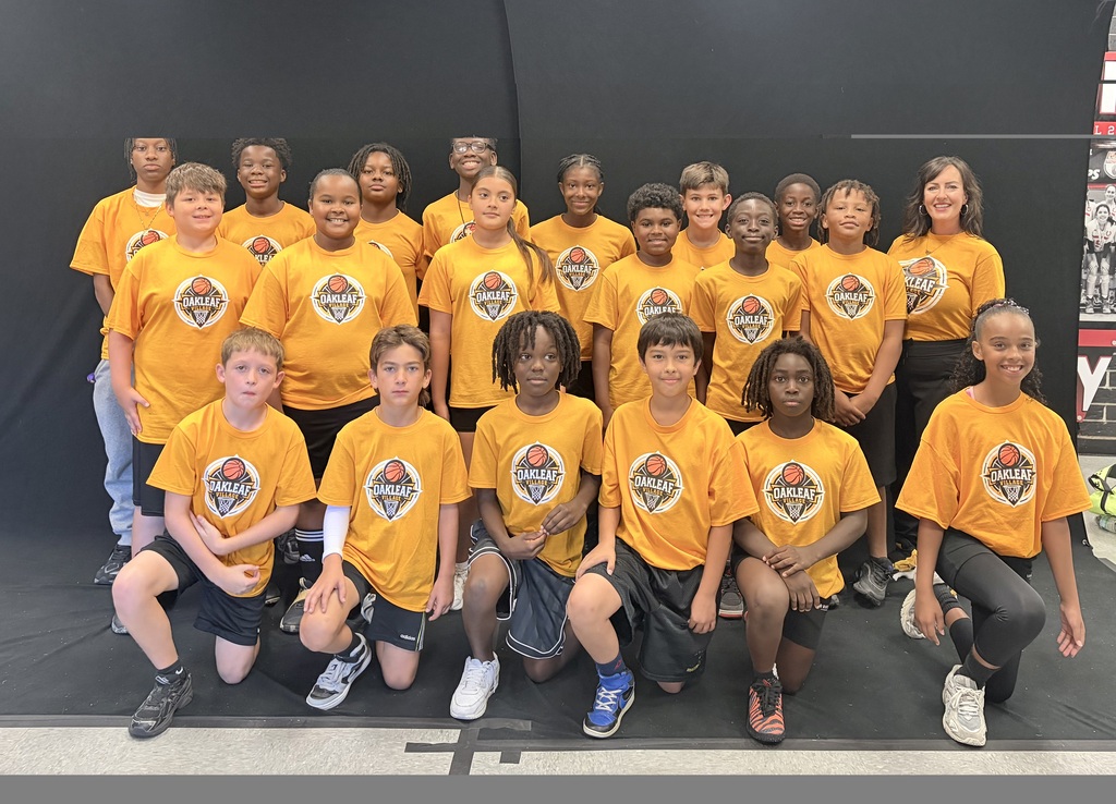 5th grade basketball team, posing for a photo with a black backdrop.