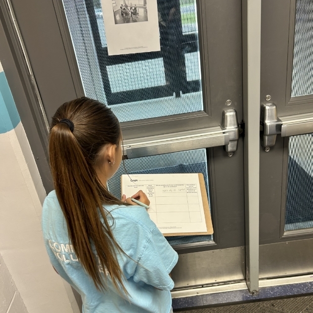 Students working writing to support their thinking. 