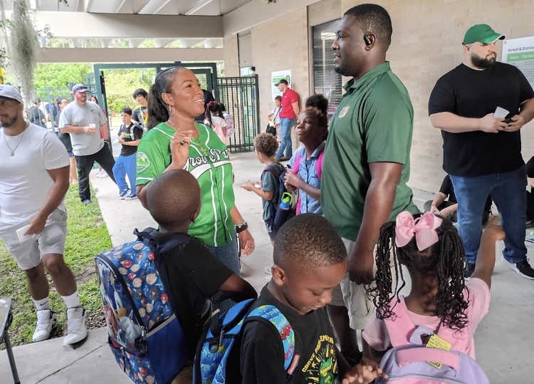 Pictures of Mrs. Smith with Students, staff and families at GPE 