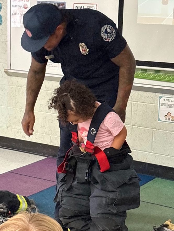 🔥 Sparking Big Smiles for Fire Prevention Week! 🧑‍🚒👩‍🚒  Ms. Richards and Mrs. Ellsworth’s class got an extra-special visit this week! Local firefighters—and proud parents of one of our awesome students—Mr. and Mrs. Diaz stopped by to teach the kids all about fire safety with a fun, hands-on lesson.  From learning how to stay safe to seeing real firefighter gear up close, our students had an absolute blast! A huge thank you to the Diaz family for spending time with us and for everything you do to keep our community safe! ❤️🚒✨  #FirePreventionWeek #CommunityHelpers #ThankYouFirefighters #PositivelyPaterson