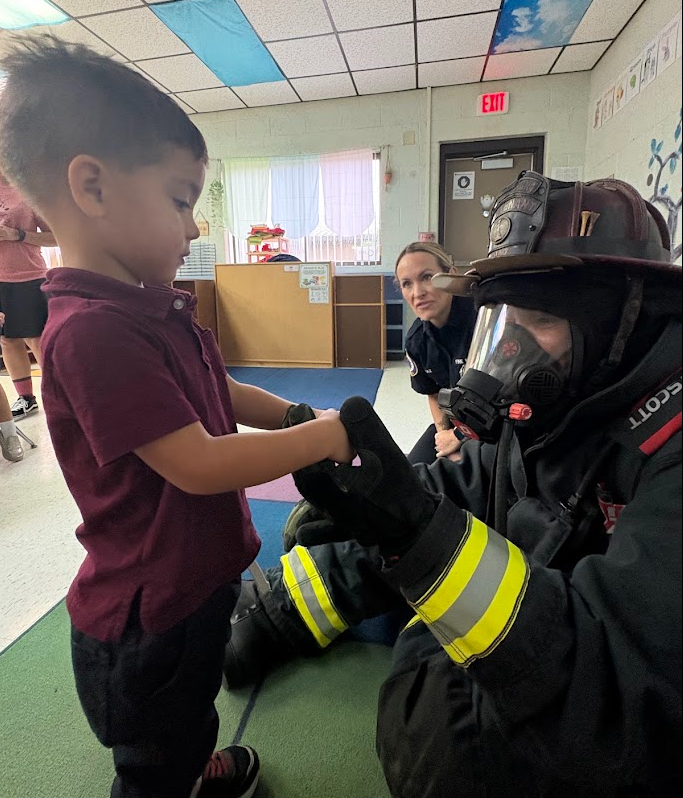 🔥 Sparking Big Smiles for Fire Prevention Week! 🧑‍🚒👩‍🚒  Ms. Richards and Mrs. Ellsworth’s class got an extra-special visit this week! Local firefighters—and proud parents of one of our awesome students—Mr. and Mrs. Diaz stopped by to teach the kids all about fire safety with a fun, hands-on lesson.  From learning how to stay safe to seeing real firefighter gear up close, our students had an absolute blast! A huge thank you to the Diaz family for spending time with us and for everything you do to keep our community safe! ❤️🚒✨  #FirePreventionWeek #CommunityHelpers #ThankYouFirefighters #PositivelyPaterson