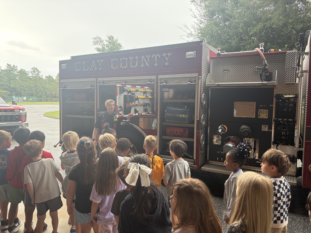 Students examining a fire truck