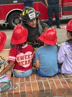 Firefighter speaks to students.