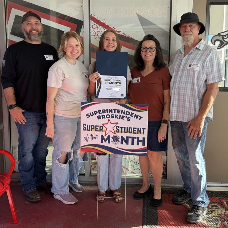Super student of the month, Harper, with her family
