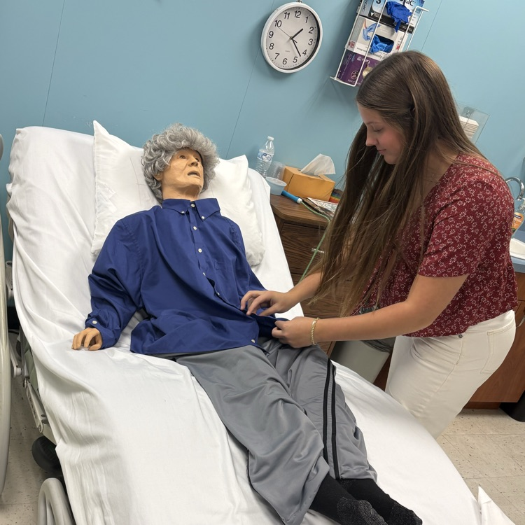 student working with patient