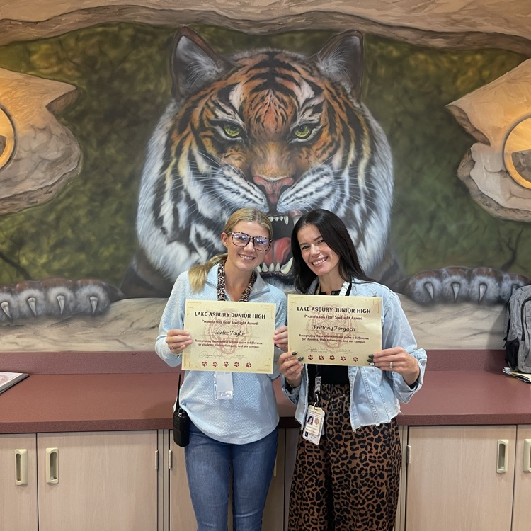 Picture of our Front Desk receptionist with their certificates