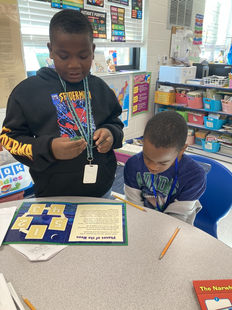 Students working together on an activity at a table