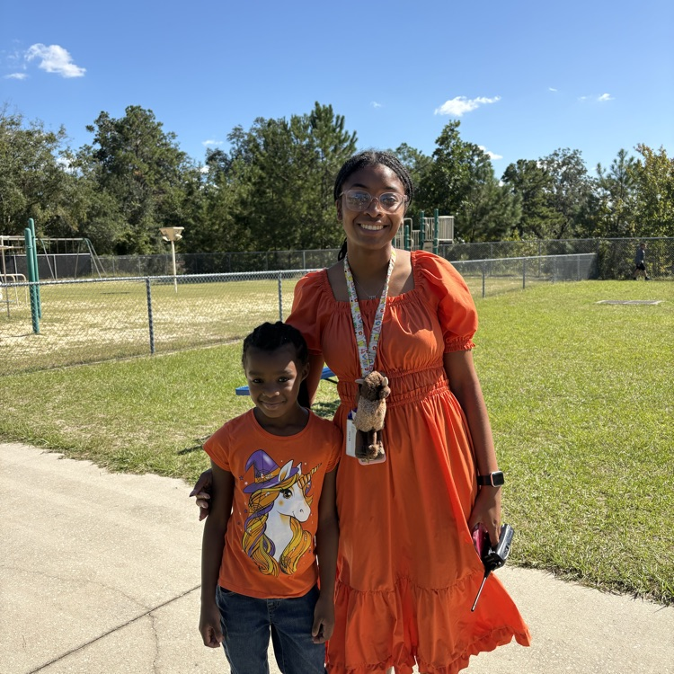 Students and staff wearing orange