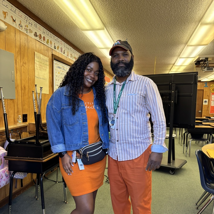 Students and staff wearing orange