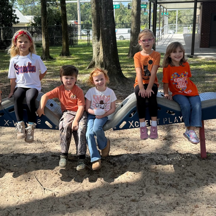 students wearing orange