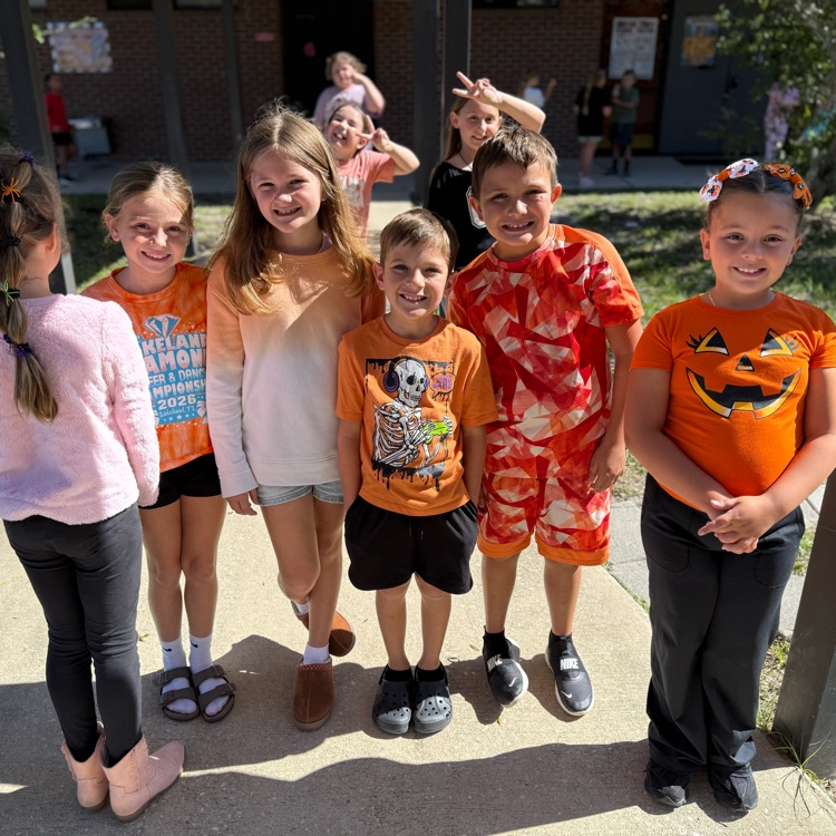 students wearing orange
