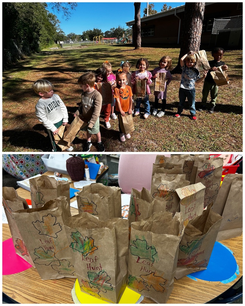 Group of children holding paper bags; some bags have drawings on them; table with bags nearby.