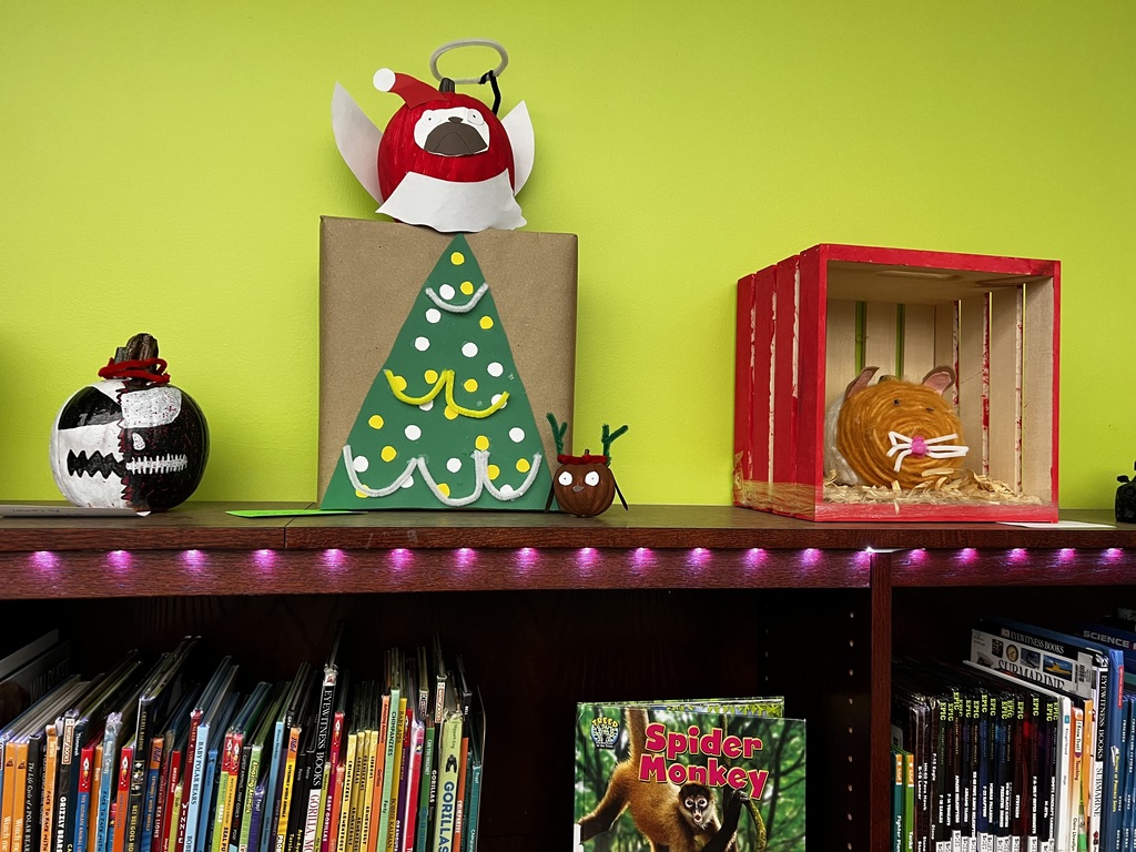 A photo of decorated book character pumpkins.