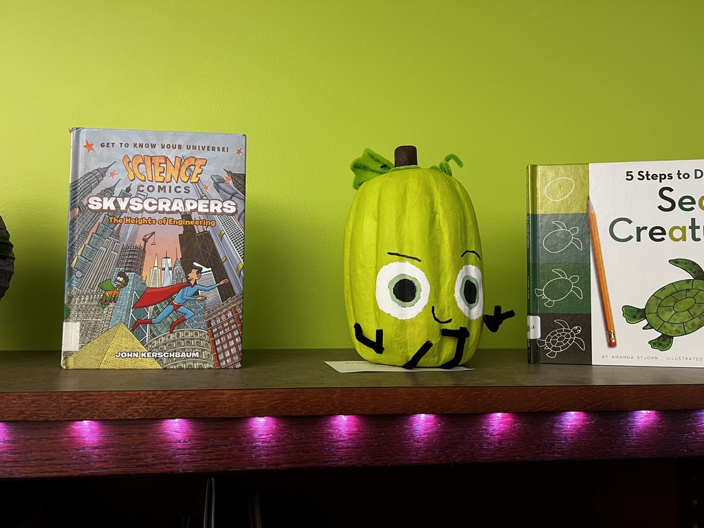 A photo of decorated book character pumpkins.