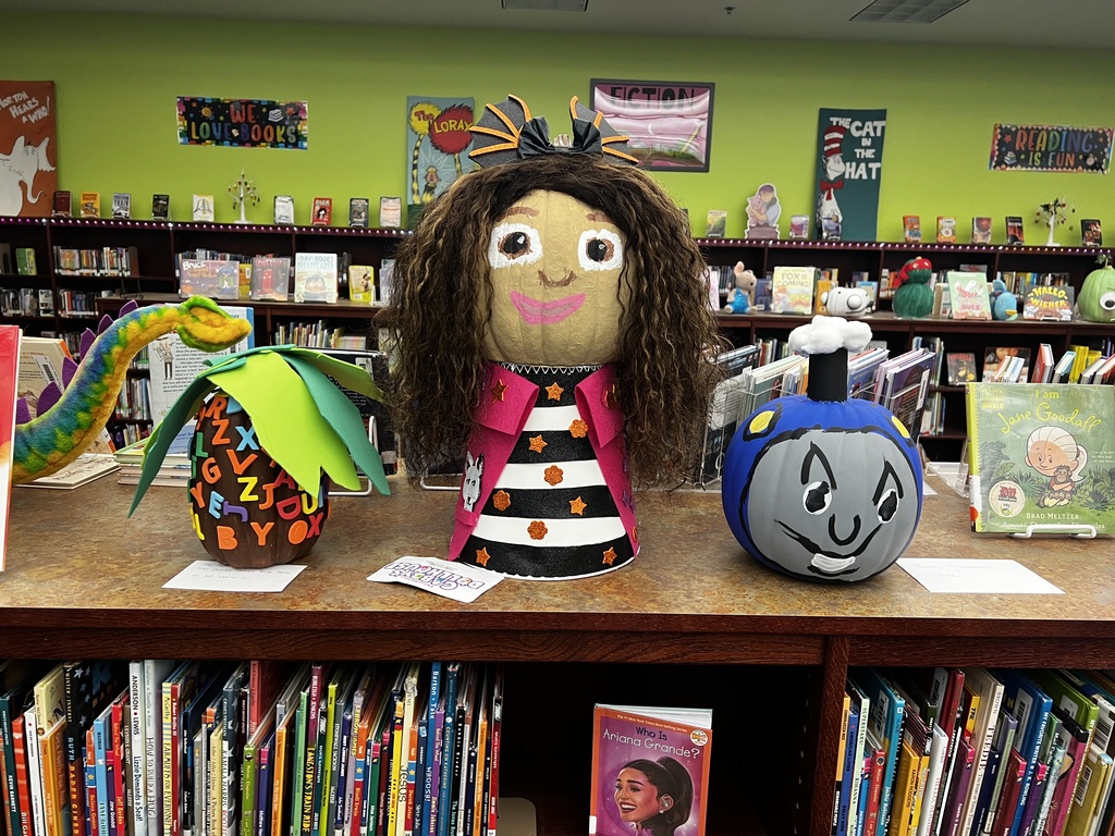 A photo of decorated book character pumpkins.