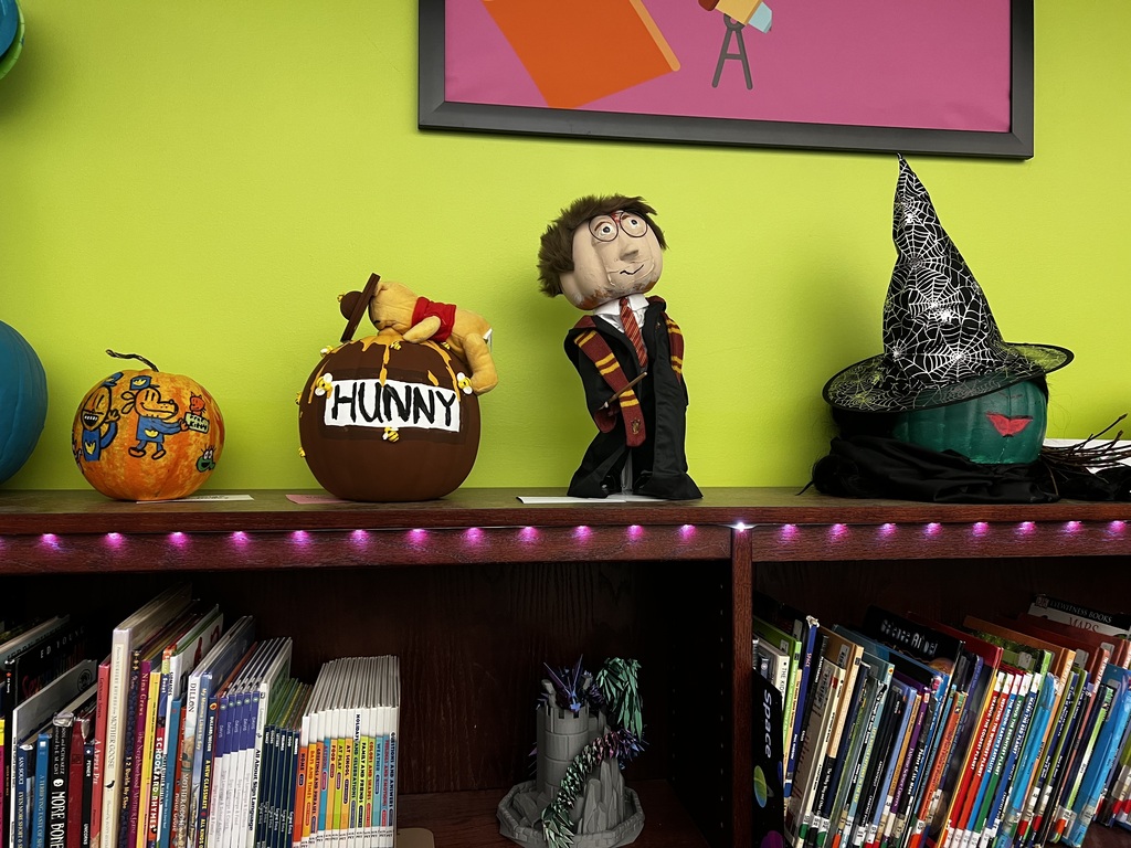 A photo of decorated book character pumpkins.