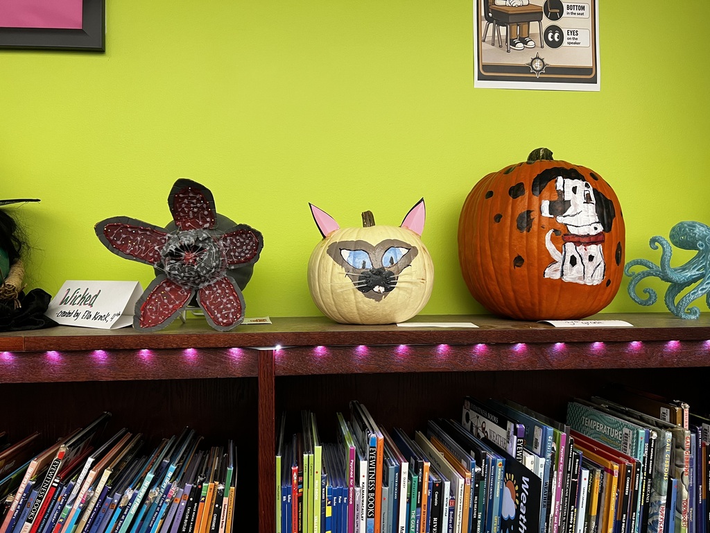 A photo of decorated book character pumpkins.