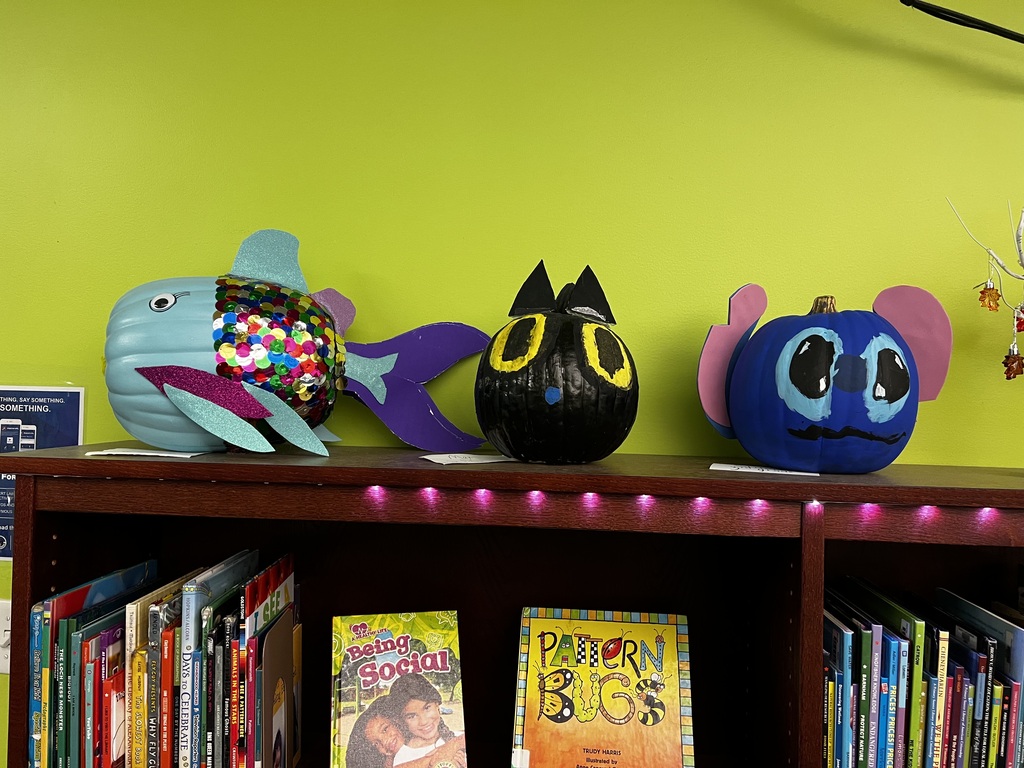 A photo of decorated book character pumpkins.