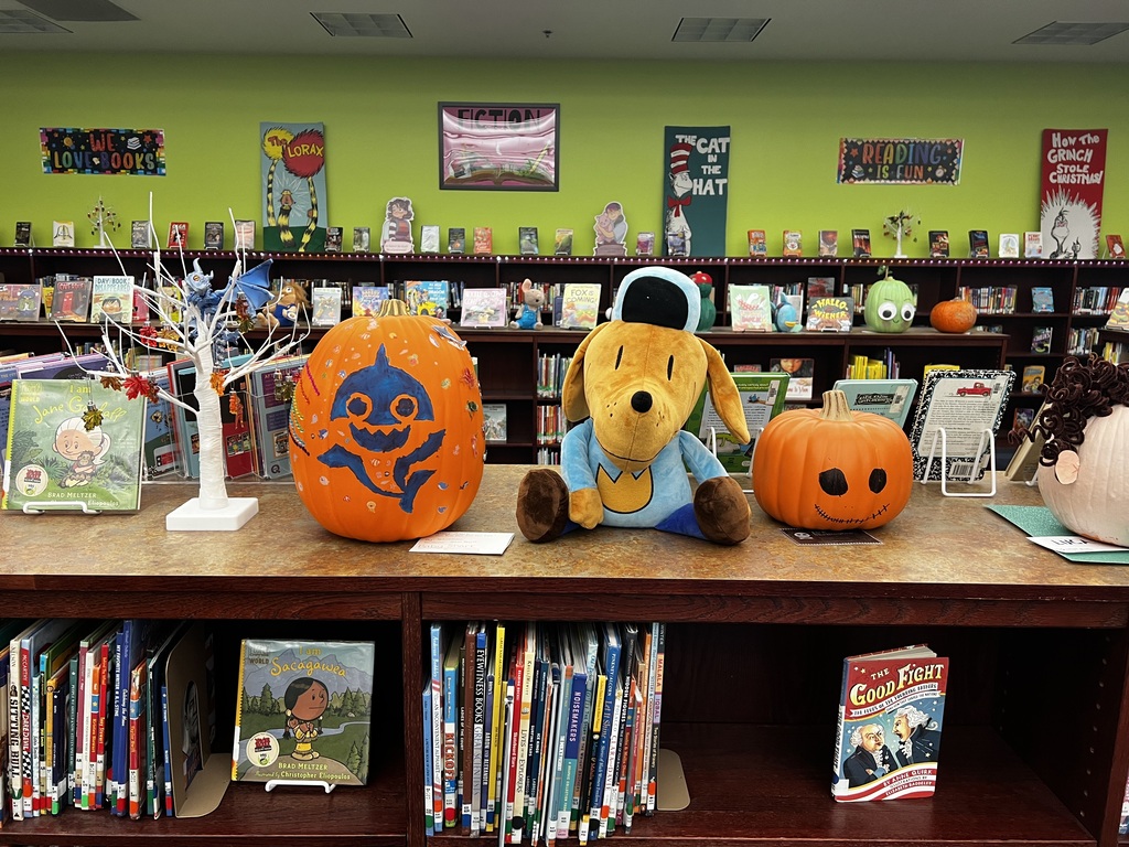 A photo of decorated book character pumpkins.