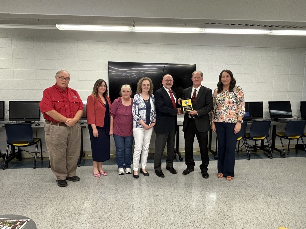 Doug Wayne with board and Superintendent and Asst. Superintendent