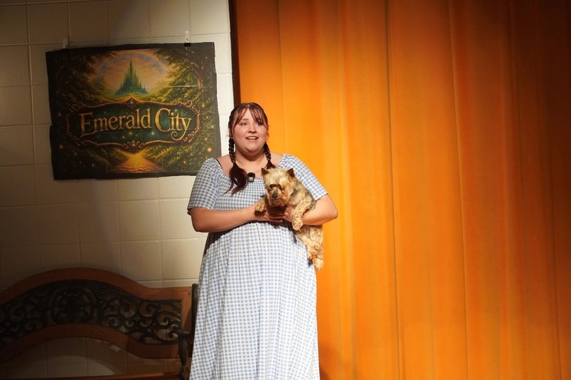 Student with Todo the dog during play