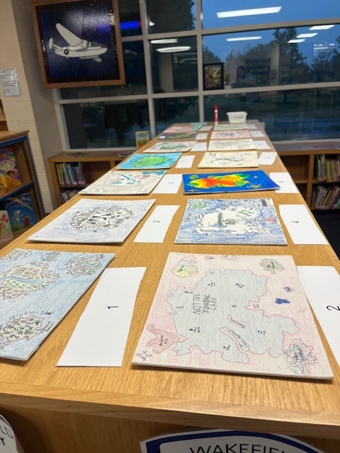 To better understand geographical features, Mr. Seuser's 7th grade geography class created rice maps. Students poured rice on a canvas and traced the pattern it created. When they took the rice off, they were left with a makeshift landform. They then filled it in and added their own features. At the end, they were asked to identify the different features of each map. #celebrate379