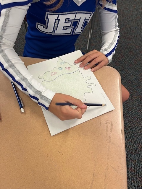 To better understand geographical features, Mr. Seuser's 7th grade geography class created rice maps. Students poured rice on a canvas and traced the pattern it created. When they took the rice off, they were left with a makeshift landform. They then filled it in and added their own features. At the end, they were asked to identify the different features of each map. #celebrate379