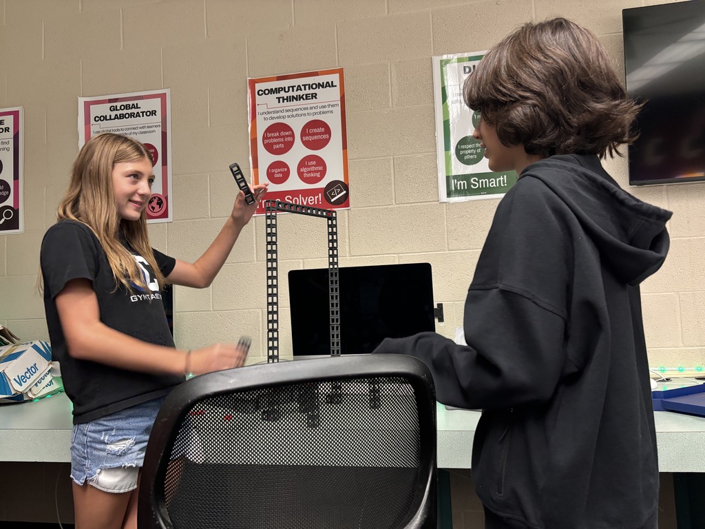 Mr. Lane's 7th grade computers/technology students have been putting their brains to the test this past week! First, they built bridges using a limited "budget" to see which structures could hold a stack of books. Then, they took to the air with their drones! The assignment was to code the drones to fly around the school filming each area, which then would turn into a virtual tour of the building.  #celebrate379